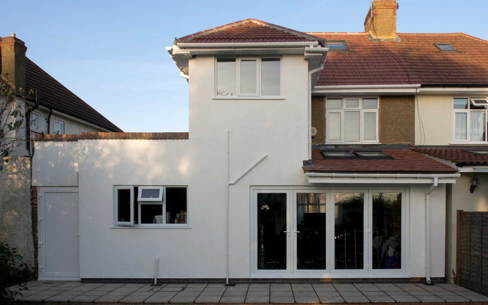 Recent extension by Northway Build Co. — modern white render rear extension on a UK semi-detached home